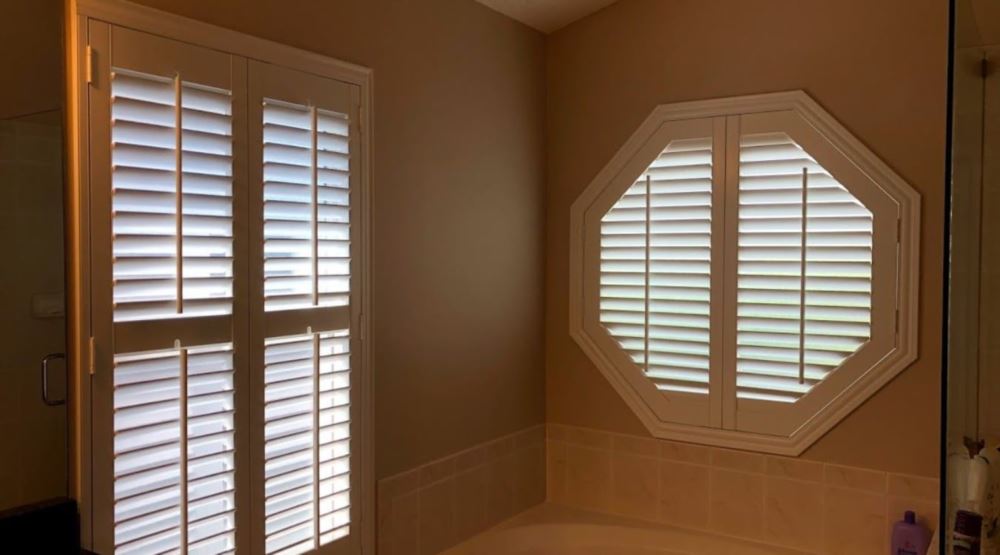 Octagon window treatments Octagon window in a Houston bathroom
