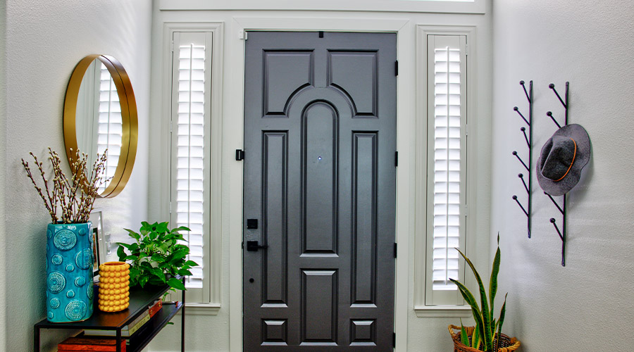 Sidelight window shutters add privacy, light control, and appeal to this home's main entry. Sidelight window shutters next to front door.